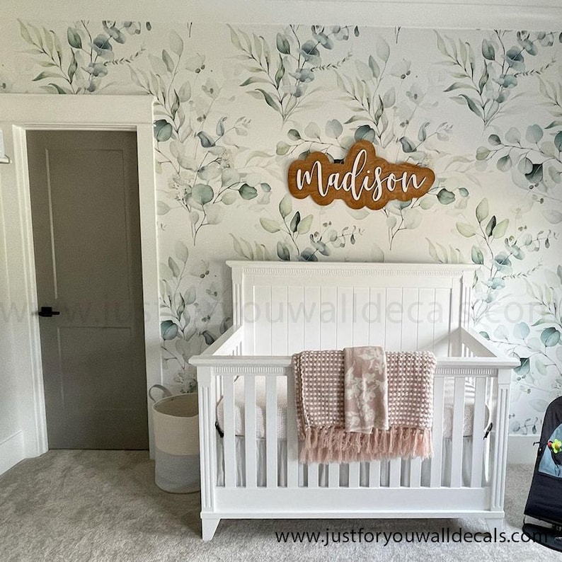 Soothing wallpaper design featuring watercolor eucalyptus branches in gentle shades of green