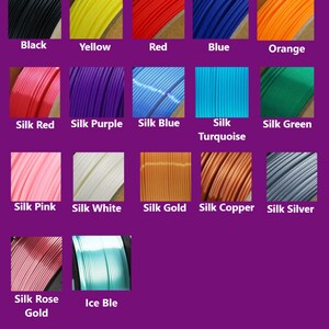 May include: A color chart displays various filament colors, including black, yellow, red, blue, and orange. Additional colors include silk red, purple, blue, turquoise, and green. The chart also shows silk pink, white, gold, copper, and silver. The text "Color Chart" is at the top.