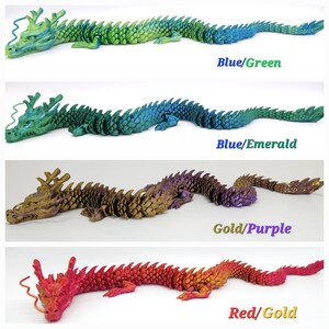 May include: Four articulated dragon toys in various colour combinations. The top dragon is blue and green, the second is blue and emerald, the third is gold and purple, and the bottom is red and gold. Each dragon has a detailed, scaled design.