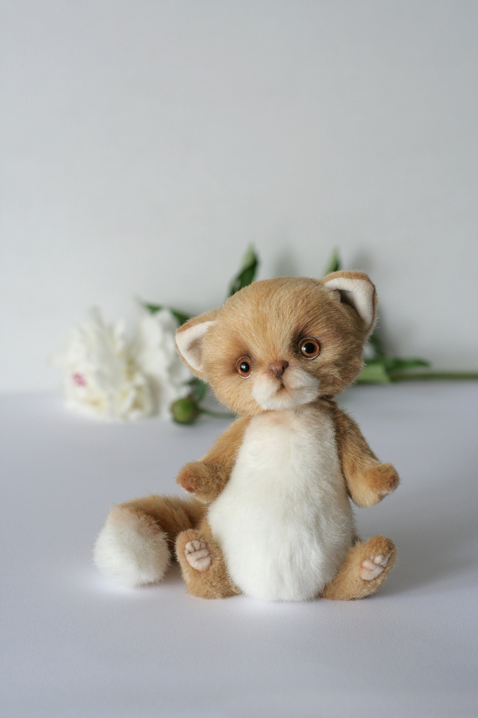 stuffed animal cat with kittens inside