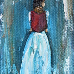May include: A painting of a person wearing a red vest and a long blue skirt, standing with their back to the viewer against a blue background.