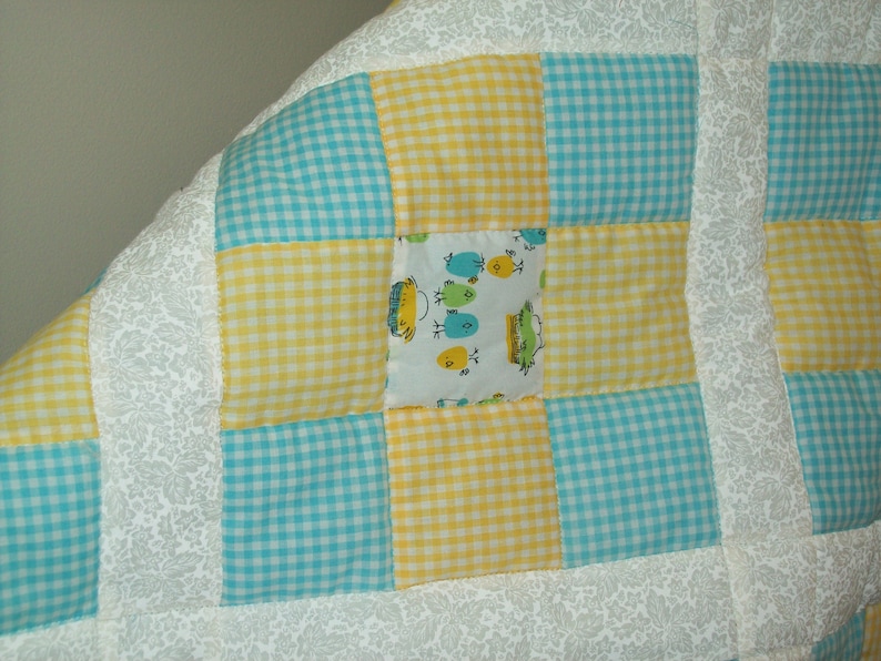 Little chicks white pieced crib quilt. turquoise