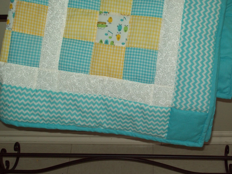 Little chicks white pieced crib quilt. turquoise