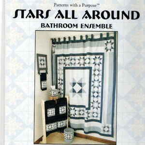 May include: A package for a bathroom ensemble pattern, featuring a shower curtain, tissue box cover, towel hanger, towel borders, and waste basket cover. The design includes star patterns in shades of blue, gray, and white. The shower curtain size is 72" x 72".