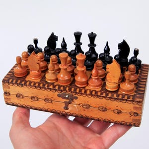 Vintage Handmade Touristic Chess Set 17x17 cm, 1980&#39;s Wooden Travel Chess Set from East Europe with Pyrography Decorated Folding Board