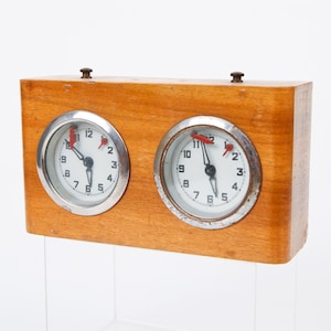 May include: A white ceramic mug with a black handle and the text "But First, Coffee" in a black, handwritten-style font. The mug is on a white surface.