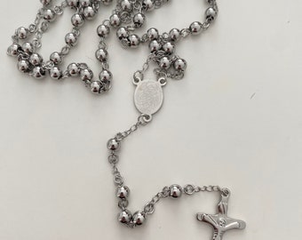 Religious Rosary from France in silver-colored steel, pendant of the Virgin Mary and Jesus on the Cross