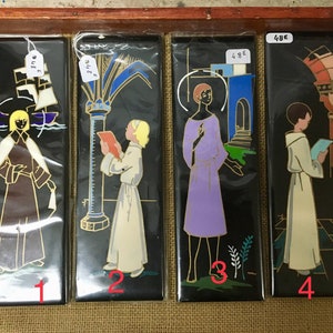 Black ceramic tile representing religious icons