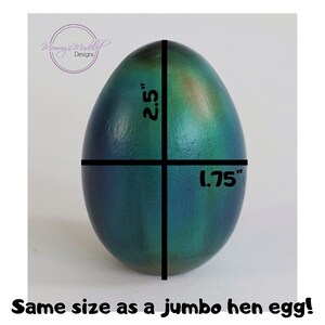 May include: A teal and green speckled egg with a black line down the centre. The egg is 2.5 inches tall and 1.75 inches wide. "Same size as a jumbo hen egg!" is written below the egg.