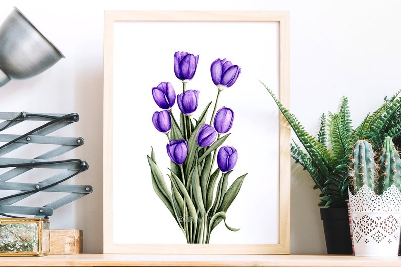 May include: A framed watercolor painting of a bouquet of purple tulips with green leaves on a white background.
