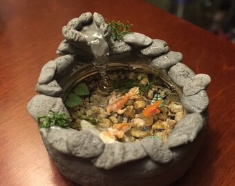 Miniature koi pond in a bottle cap!