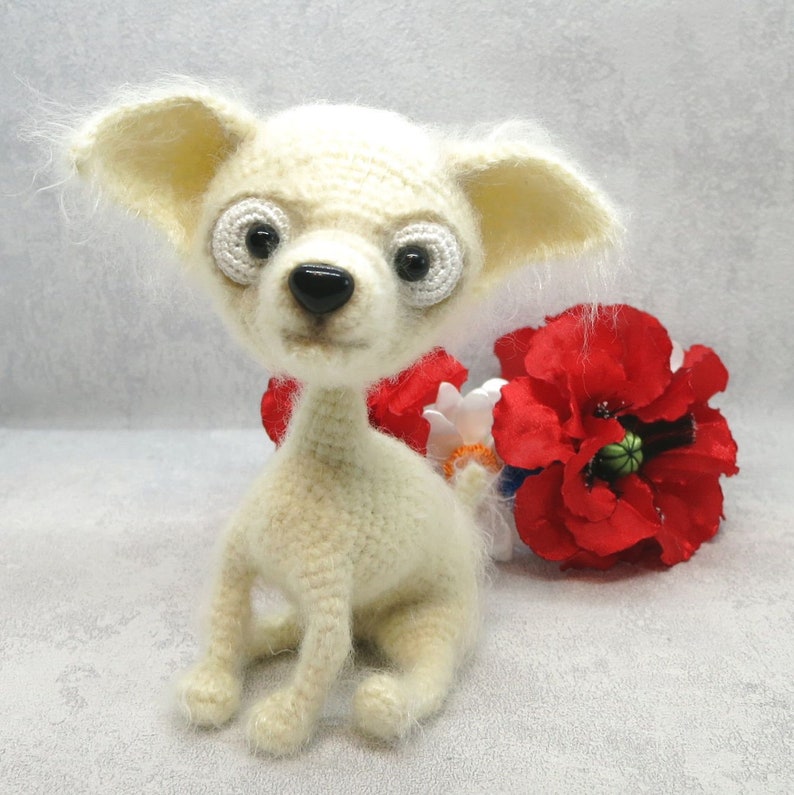 White crochet chihuahua is the best present for kids Amigurumi funny dog can be an interior toy or birthday gift for all.