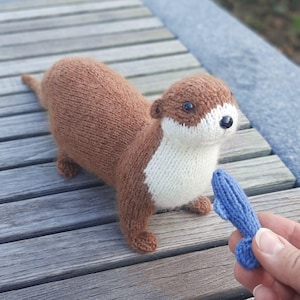 Knitted Otter Stuffed Animal: Realistic Plush Toy with Fish
