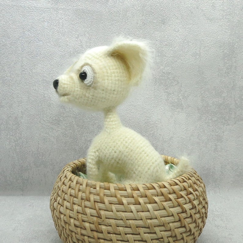 White crochet chihuahua is the best present for kids Amigurumi funny dog can be an interior toy or birthday gift for all.