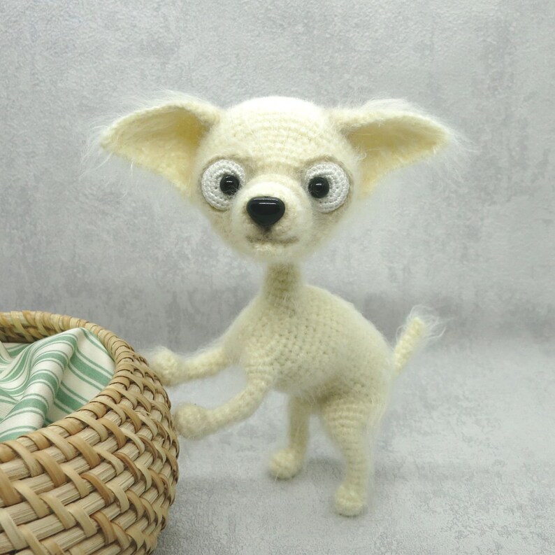 White crochet chihuahua is the best present for kids Amigurumi funny dog can be an interior toy or birthday gift for all.