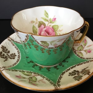 Vintage EB Foley Fancy Embossed Green Foley Cup And Saucer With Pink Roses Rosebuds And Gold Accents Rare Shape