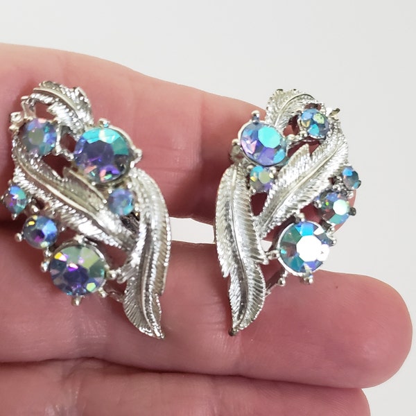 Mid Century Coro Climber Clip On Earrings, Textured Silver Tone Leaves and Blue Aurora Borealis Rhinestones