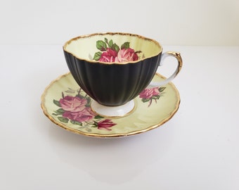 Taza de té y platillo EB Foley: exterior negro, rosas rosadas, detalles dorados