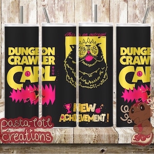 May include: Four black tumblers with silver straws. The tumblers feature the text "DUNGEON CRAWLER CARL" in yellow and pink, along with a cartoon illustration of a cat wearing glasses. The words "NEW ACHIEVEMENT!" are also visible.