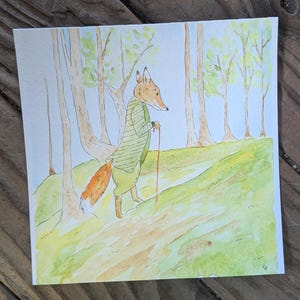 May include: Watercolor painting of a fox in a green striped shirt and pants, walking with a cane through a forest. The fox has an orange tail and is walking on a green hill. Trees with green leaves are in the background.
