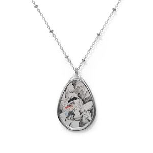 May include: Silver pendant necklace with a teardrop-shaped pendant. The pendant displays a monochrome illustration of a person with a red cape running through a snowy mountain scene. The chain is a delicate link style.
