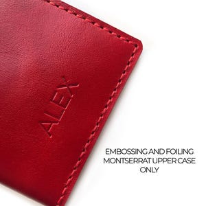 May include: Close-up of a red leather item with the embossed name "ALEX". The item has a stitched border and text that reads "EMBOSSING SAMPLE" and "EMBOSSING AND FOILING MONTSERRAT UPPER CASE ONLY".