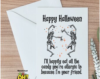 May include: A white card with a black and white illustration of two skeletons dancing. The text "Happy Halloween" is at the top of the card. The text "I'll happily eat all the candy you're allergic to because I'm your friend." is at the bottom of the card.
