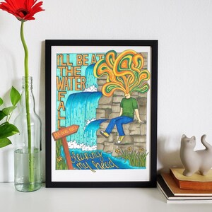 May include: Framed illustration of a person sitting by a waterfall with the text "I'll be at the waterfall clearing my head". The illustration is in a cartoon style with bright colours and a whimsical feel.