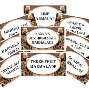 May include: Assortment of homemade marmalade jars with labels, including "Lime Marmalade", "Orange & Lemon Marmalade", "Orange, Lemon & Lime Marmalade", "Three Fruit Marmalade", "Nanna's Best Homemade Marmalade", "Marmalade Thin Cut", "Marmalade Thick", and "Seville Orange Marmalade".