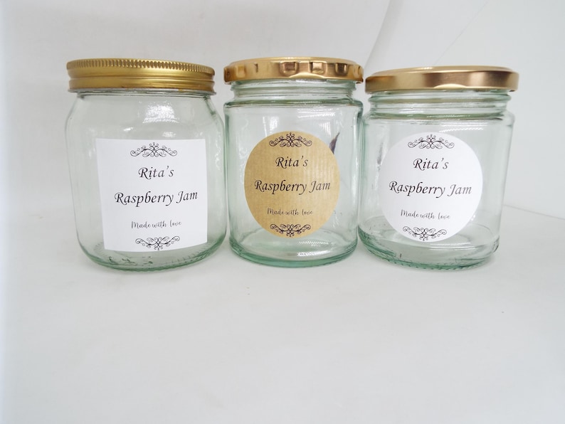 May include: Three glass jars with gold lids and labels that say "Rita's Raspberry Jam" and "Made with love".