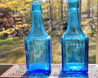 Two Blue Wheaton Glass Bitters Bottles