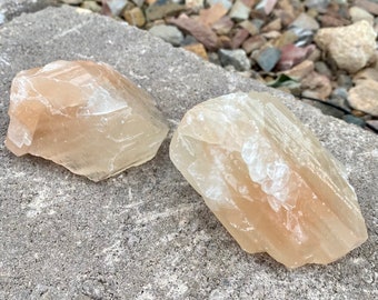A pair of Light peach and raw green calcite Andara volcanic crystal glass rough 1.9kg