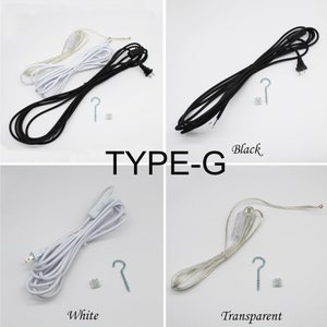 May include: Four electrical cords in black, white, and transparent colors, with a Type-G designation. Each cord has a plug, a hook, and a small connector. The word "Black", "White", and "Transparent" are written below the cords.