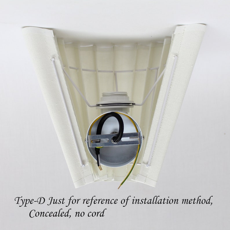 May include: Cream-colored lampshade with a pleated design, supported by a metal frame. The internal wiring and bulb socket are visible. The text "Type-D Just for reference of installation method, Concealed, no cord" is printed at the bottom.