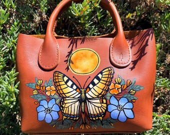 Hand Monarch Butterfly Harvest Moon PLG Raindrop Crossbody Bag