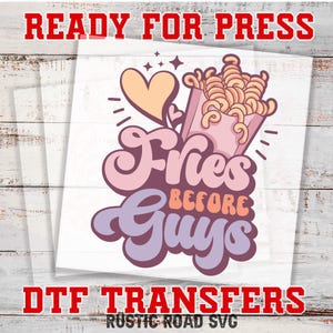 May include: A pink and purple graphic design with the text "Fries Before Guys" and a cartoon image of a heart and a bag of fries.