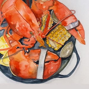 May include: A watercolor painting of a lobster and corn on the cob in a black cast iron skillet. The lobster is red and the corn is yellow. The skillet has a black handle.