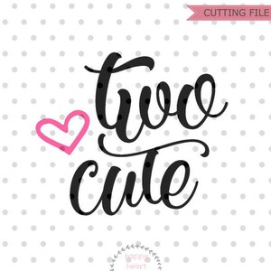 May include: A black and white graphic design with the text "two cute" in a cursive font. A pink heart is to the left of the text.