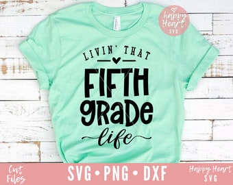 May include: A light green t-shirt with the text "Livin' That Fifth Grade Life" in black lettering. The text is surrounded by a black line and a small heart.