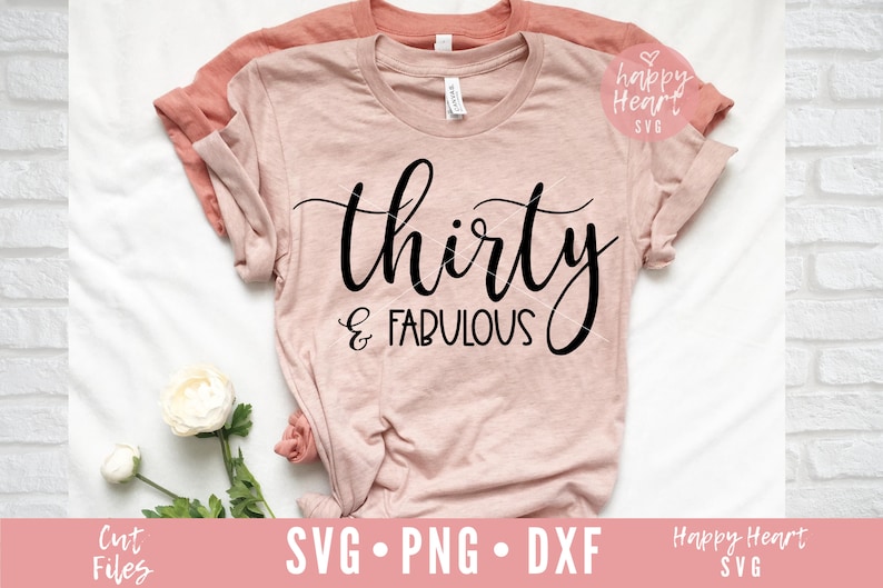 May include: A pink t-shirt with the text "thirty & fabulous" in black cursive script.