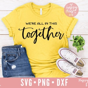 May include: A yellow t-shirt with the text "WE'RE ALL IN THIS together" in black script font.