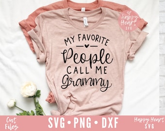 May include: A pink t-shirt with the text "My Favorite People Call Me Grammy" in black script font.