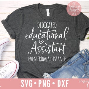 May include: A charcoal grey t-shirt with the text "DEDICATED educational Assistant EVEN FROM A DISTANCE" in white script. The image includes denim shorts and white trainers. The image also includes SVG, PNG, and DXF cut files.