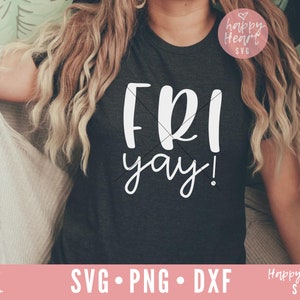 May include: A dark gray t-shirt with the text "FRI yay!" in white. The shirt is being worn by a person with long blonde hair.