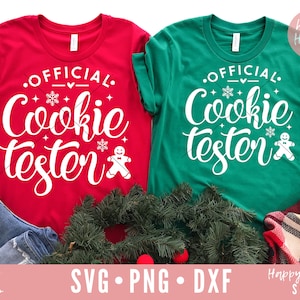 May include: Two red and green t-shirts with the text "Official Cookie Tester" and a gingerbread man graphic.