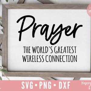May include: A white sign with a gray frame, featuring the text "Prayer" in a large, stylized font. Below the word "Prayer", the text "The World's Greatest Wireless Connection" is displayed in a smaller font.