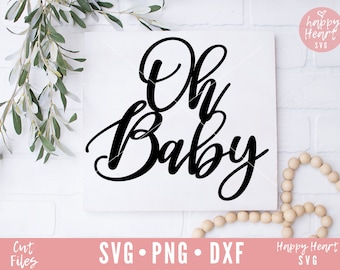 May include: A white background with a black calligraphy design that says "Oh Baby". The design is on a white card with a white brick wall background.