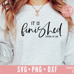 May include: A gray sweatshirt with the text "IT IS finished JOHN 19:30" in black cursive lettering.
