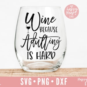 May include: Wine glass with the text "Wine because adulting is hard" in black lettering. A small wine glass icon is above the text.