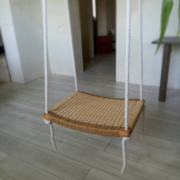 Swing with a wicker seat